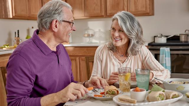 Seniors eating in a kitchen